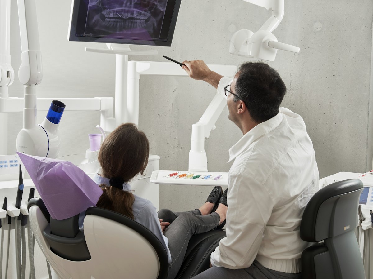 Dentist checking a patient's teeth during a routine check-up