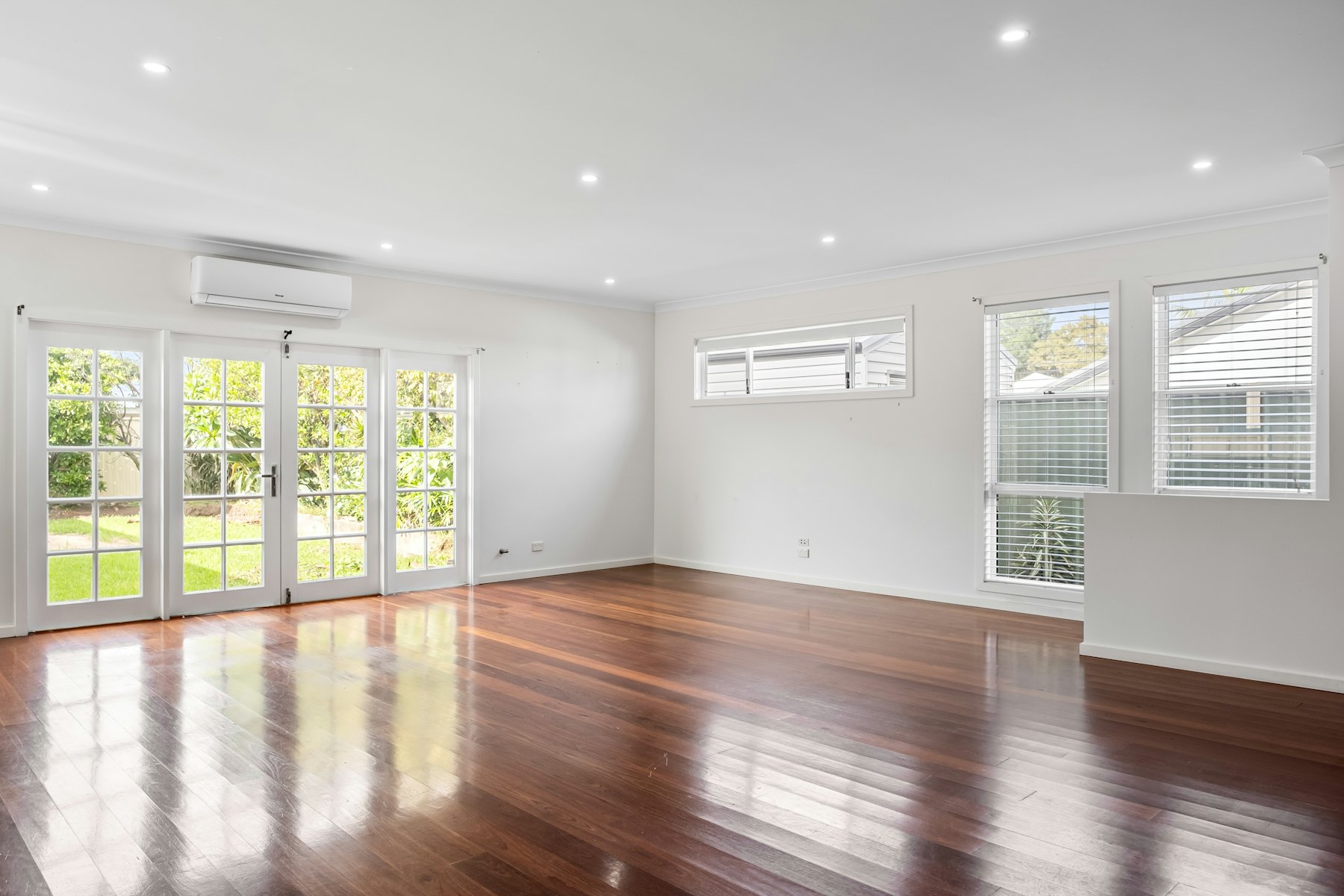 Empty living room with new hardwood floors